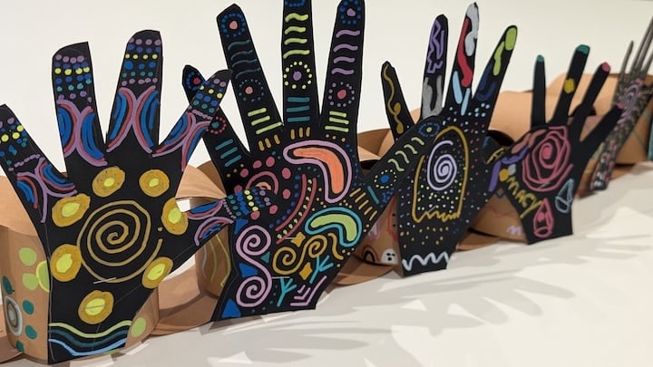Many Hands, One Community - Aboriginal Artwork on large Hand Cutouts